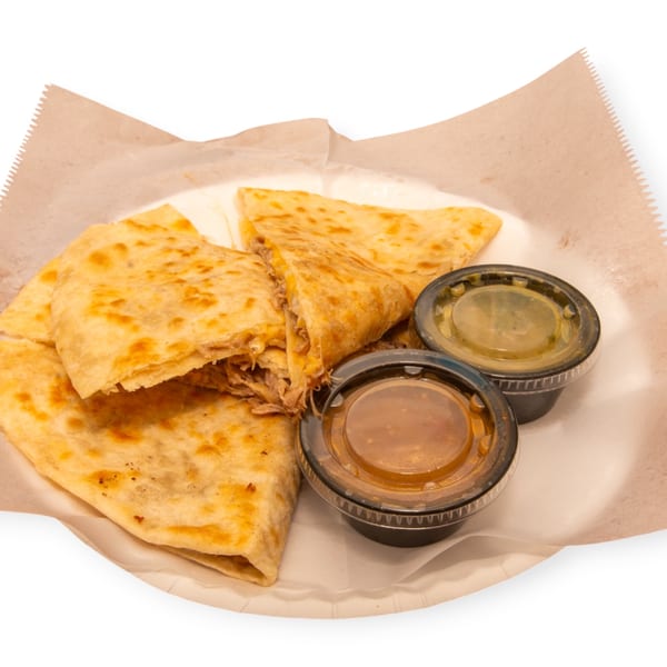 Golden-brown quesadillas filled with meat and cheese, served with two dipping sauces in a paper-lined basket.